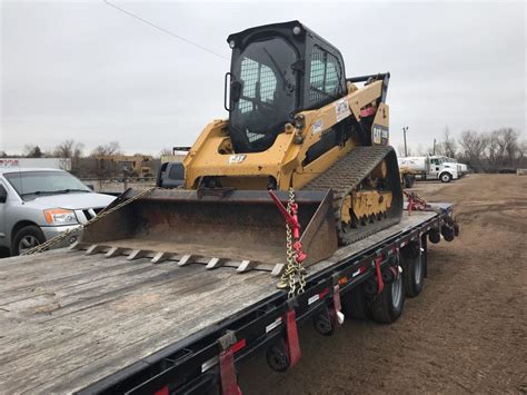 transporting a skid steer|driving a skid steer loader.